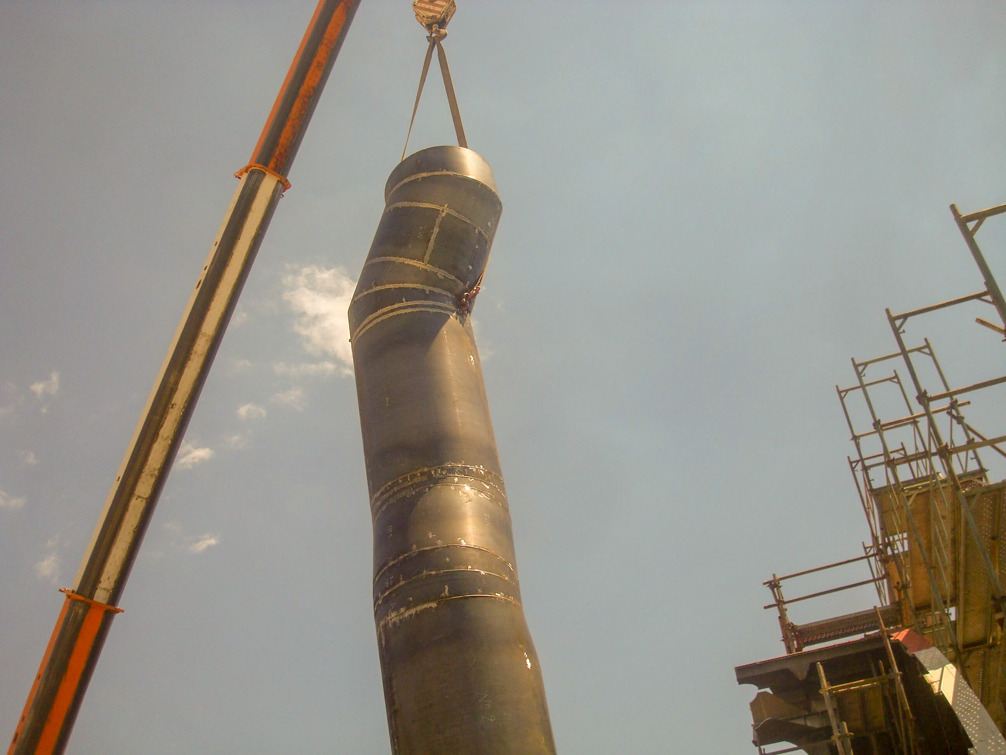 Crane lifting a fabricated funnel section